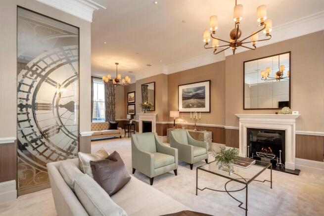 Drawing room with fireplace and etched glass door