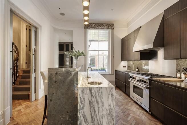 Principal kitchen with marble island and range cooker