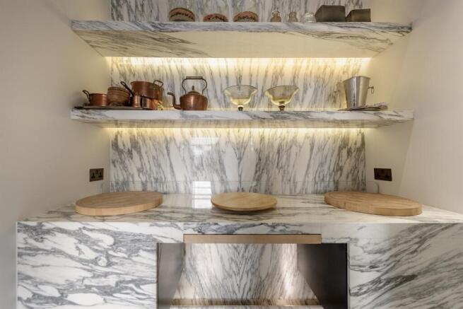Marble larder with copper pans